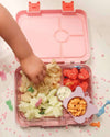 A baby picking food from here Unicorn Pink Bento Boxes from Kiddy Planet Bento Lunch Box